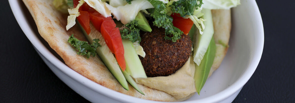 Falafel sandwich on a plate banner