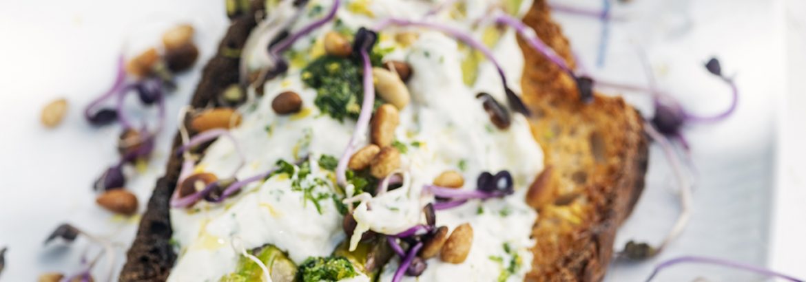 Roasted asparagus with burrata, lemon gremolata, pine nuts, and radish seedlings on some toasted sourdough bread. Perfect for a light summer lunch.