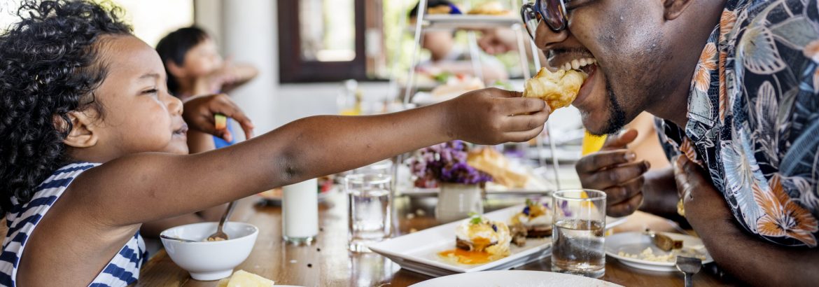 Guests having breakfast at hotel restaurant