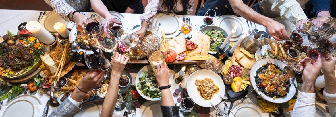 Overhead view of friends enjoying a luxury meal at restaurant