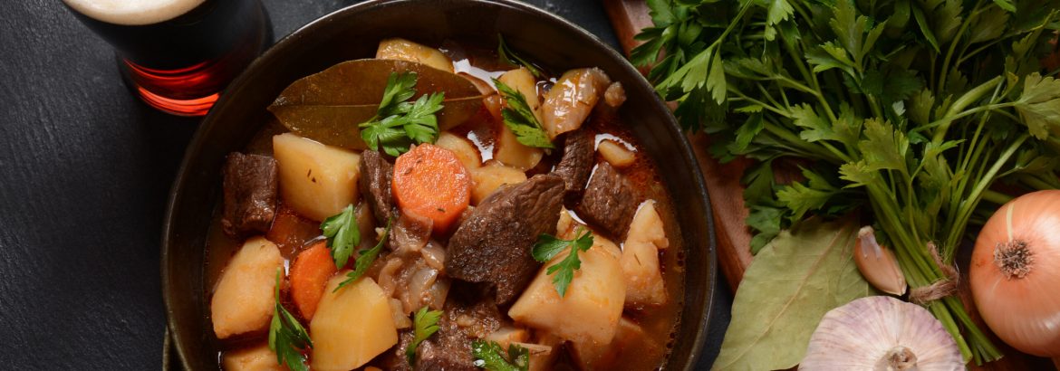 Irish stew made with beef, potatoes, carrots and herbs. Traditional St.Patrick's day dish, stewed in dark Guinness beer