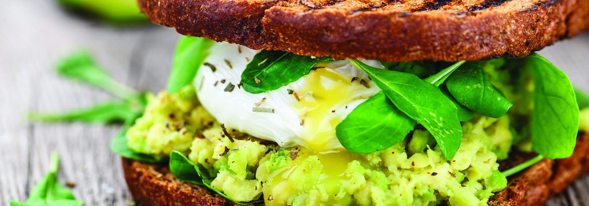 Sandwich with avocado and poached egg