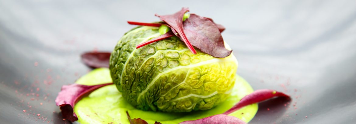 Cutlet of meat or vegetables wrapped sheet Brussels sprouts in sauce. Version of the Russian food - cabbage rolls (Golubtsyi).