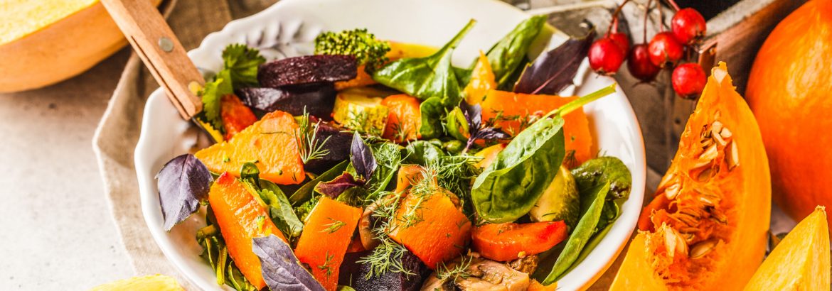 Autumn salad from baked pumpkin, beet, zucchini and carrots. Healthy vegan food concept. Autumn food concept.
